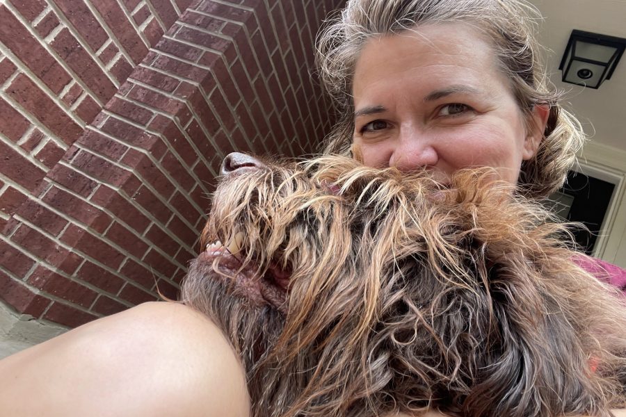 Woman posing with fluffy dog